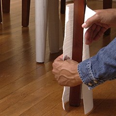 PP cohesive foam is being wrapped around a chair's legs.