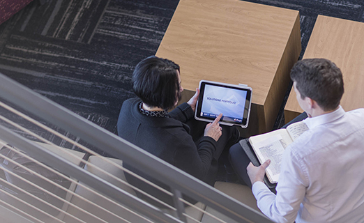 Pregis Employees working on tablet